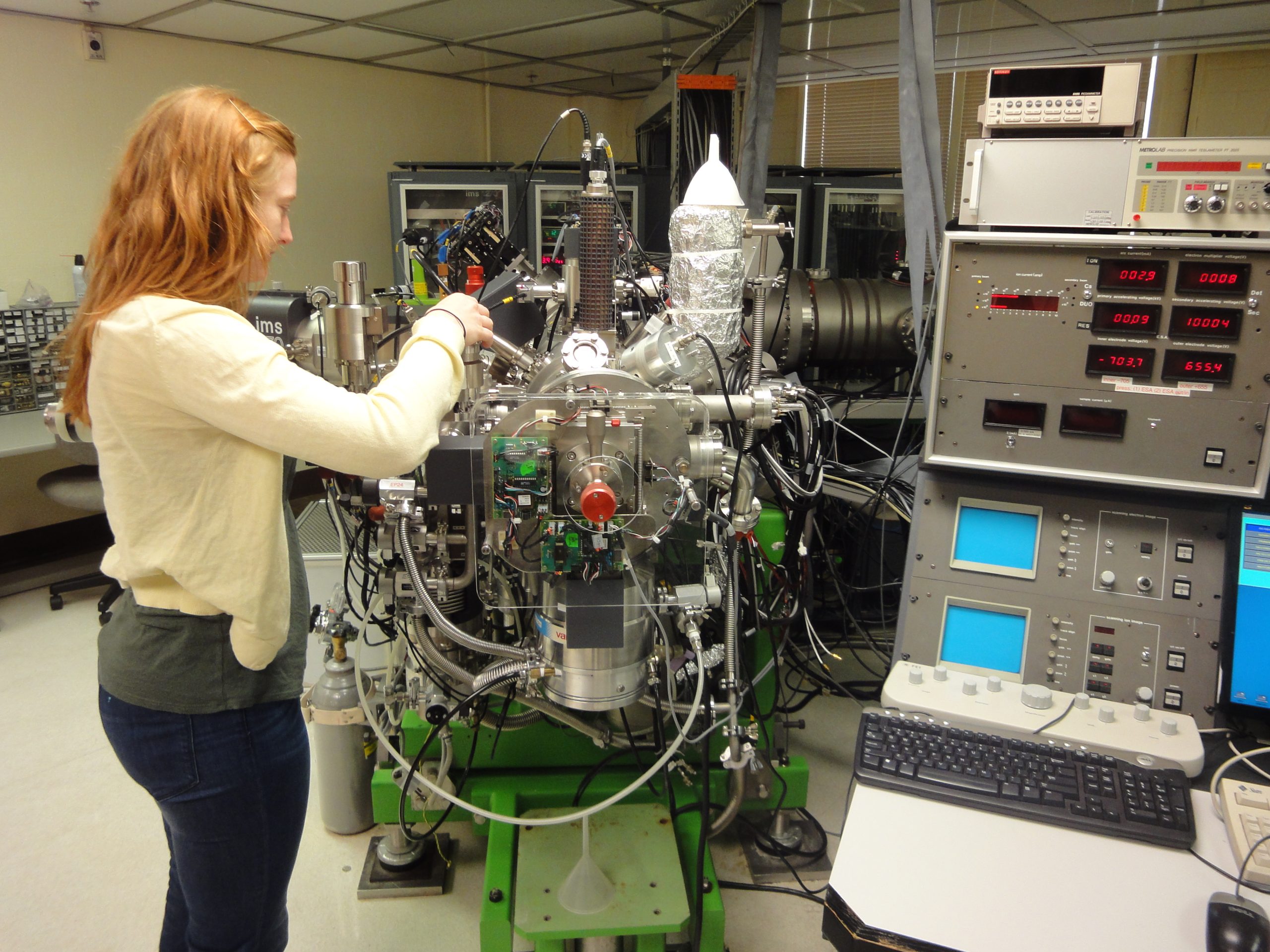 Student working with the UCLA ion microprobe.