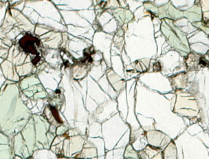 Four-phase spinel lherzolite from the Rio Grande Rift, New Mexico olivine (transparent), clinopyroxne (green), orthopyroxene (tan), spinel (brown/opaque).