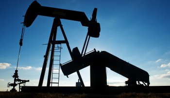 A pump jack operates in an oil field near Corpus Christi, Texas, U.S., on Thursday, Jan. 7, 2016. Crude oil slid Thursday to the lowest level since December 2003 as turbulence in China, the worlds biggest energy consumer, prompted concerns about the strength of demand. Photographer: Eddie Seal/Bloomberg via Getty Images