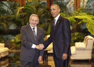 Cuban President Raul Castro, left, shakes hands with U.S. President Barack Obama during a meeting in Revolution Palace, Monday, March 21, 2016. Brushing past profound differences, President  Obama and President Castro sat down for a historic meeting, offering critical clues about whether Obama's sharp U-turn in policy will be fully reciprocated. (AP Photo/Ramon Espinosa)