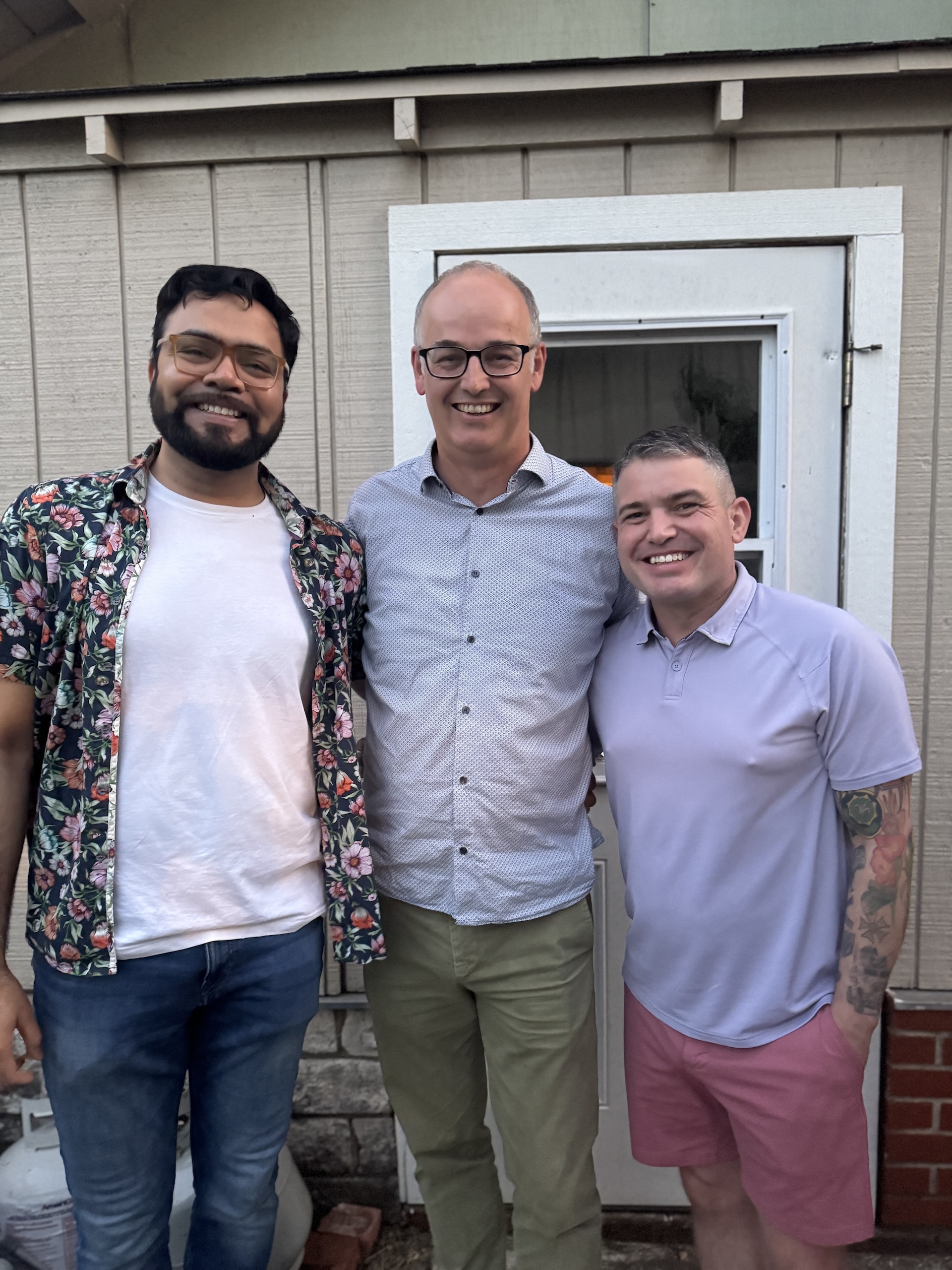 Photo of Shadab, Hesse and Hiatt in an informal backyard setting.