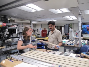 Kaustubh Thirumalai and Kate Littler, a paleoclimatologist at the University of Exeter in the U.K., discuss drill samples. Liping Zhou.