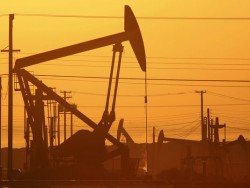 Pump jacks are seen at dawn in an oil field over the Monterey Shale formation in March 2014 near Lost Hills, California. Getty Images