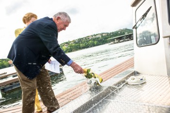 Scott Petty christens the Jackson School’s new coastal research vessel.