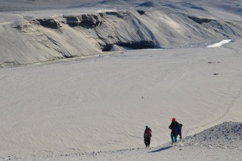 Jackie Watters and Stephen Chignell descend into the Garwood river floodplain to investigate the recently re-exposed massive ice cliff in Garwood valley in Antarctica.