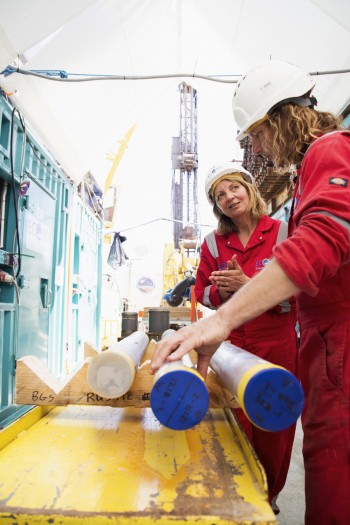 C0-cheifs Joanna Morgan (left) and Sean Gulick examine core samples.