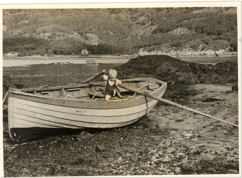 Old photo of Ian Dalziel as a child on a rowing boat