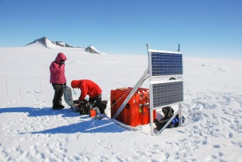 Researchers work with the HOWD PoleNet seismic station in Antarctica’s Howard Nunataks.