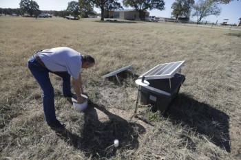 Scott Passmore, director of public works, checks on a solar powered seismic monitor that records earthquakes within the city limits of Reno, Texas in this 2014 photo. Southern Methodist University installed the monitoring device to better document the earthquakes in the area.