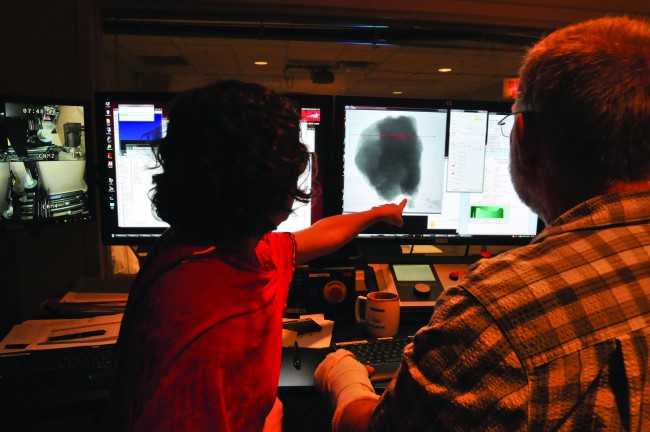 Artist Erika Blumenfeld (Left) and Research Scientist Matt Colbert Examine A CT Scan