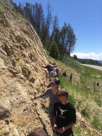 Conner Everts and assistant instructor Meredith Bush examining the fault scarp of the 1959 Hebgen Lake Earthquake in southwest Montana.