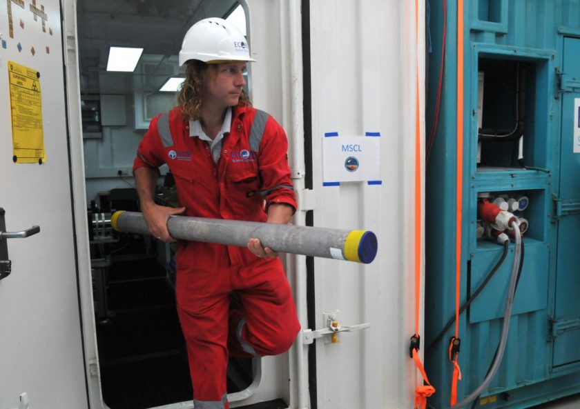 Research Professor Sean Gulick carries a core sample