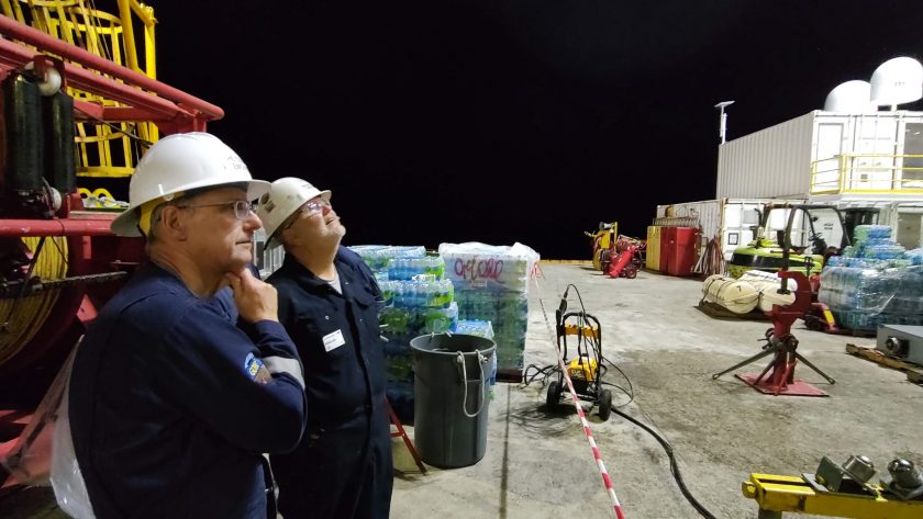 The Jackson School's Peter Flemings and company man, Tom Pettigrew watching drilling operations. Both are veterans of ocean drilling and know that doing expeditionary science at sea often comes with setback. Credit: Jackson School