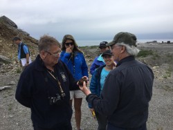 John Dewey (left) discussing a rock sample with Jack Casey.