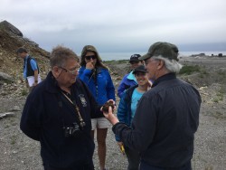 John Dewey (left) discussing a rock sample with Jack Casey. 