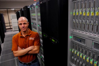 Omar Ghattas with super computing processors at the Texas Advanced Computing Center.