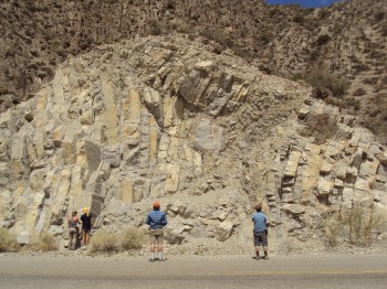 Students examine a rock formation. Photo courtesy of Brian Horton.