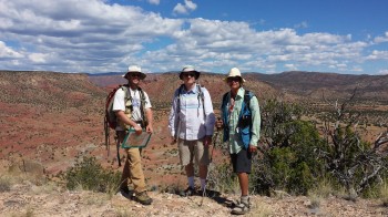 Joel Saylor (University of Houston), Brian Horton (Jackson school), and Mike Murphy (U of H) stand above the Espanola basin in the New Mexico desert. Lily Jackson.