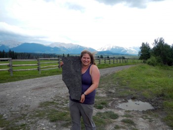 Rowan Martindale, a professor at the Jackson School of Geosciences, with a slab of bivales recovered from the fossil site. Rowan Martindale, The University of Texas at Austin.