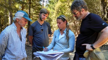 Rempe discussing geophysical survey locations with collaborators. Alex Bryk.