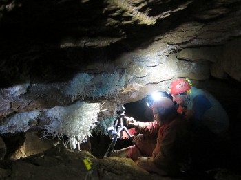 Tisato studies mineral deposits called speleothems in Asperge Cave in France with research colleagues.Tomaso Bontognali. 