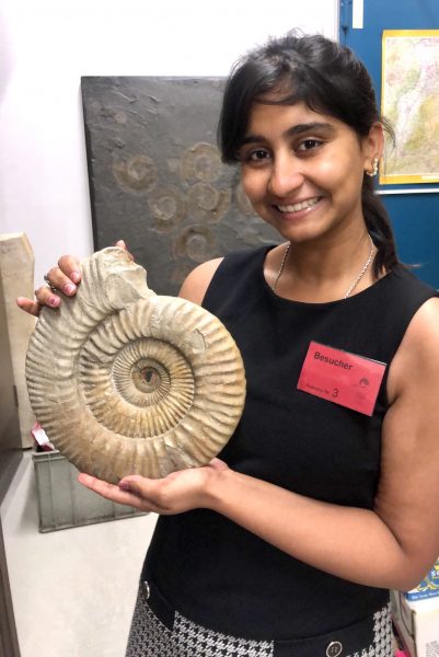 Sinjini Holding A Jurassic Fossils At The Staatliche Museum Für Naturkunde Stuttgart, Germany