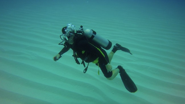 Chris Zahm floats over rippled shelf margin skeletal sands 