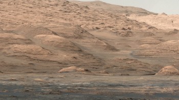 A view from the lower flank of Mount Sharp, a sedimentary mound inside Gale Crater on Mars. NASA/JPL-Caltech/MSSS.