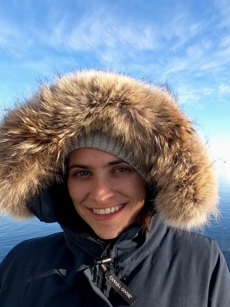 Photo of Natalie wearing a fur-lined cold-weather coat.