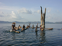 Boys from nearby villages practicing traditional fishing methods on Lake Bosumtwi. Large tropical trees submerged in 15-20 meters of water provide evidence of severe, long lasting droughts just a few centuries ago. Photograph by J.T. Overpeck and W. Wheeler, University of Arizona.