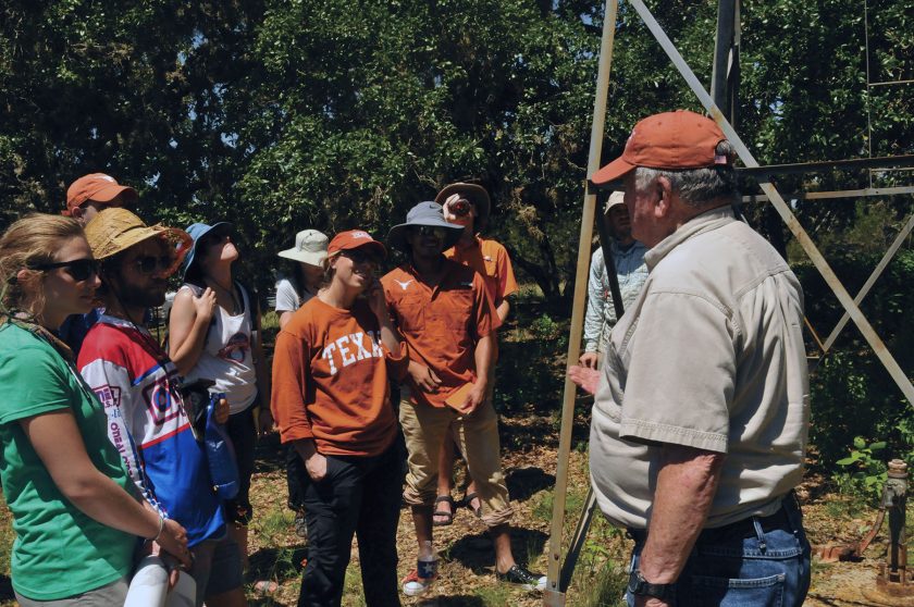 White speaking to the hydrology field camp.