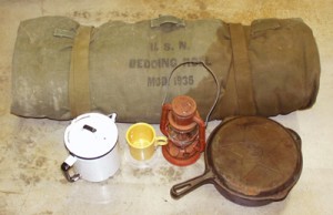 bedroll, lantern, coffee pot, bean pot