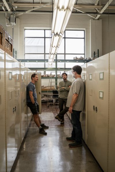 Osteological Lab Manger Kenneth Bader chatting with Collections Manger J. Chris Sagebiel and UT Alum Dr. John Moretti.