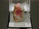 Tugtupite image.