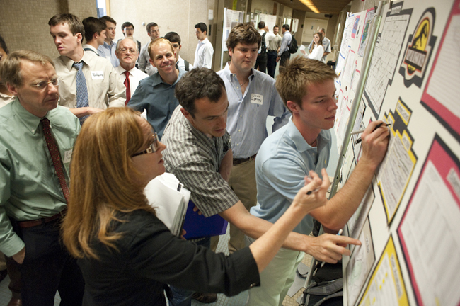 Undergraduate Steven Gohlke (front right) of the Reptar Resources team answers questions from the judges during the 2010 lease sale competition.